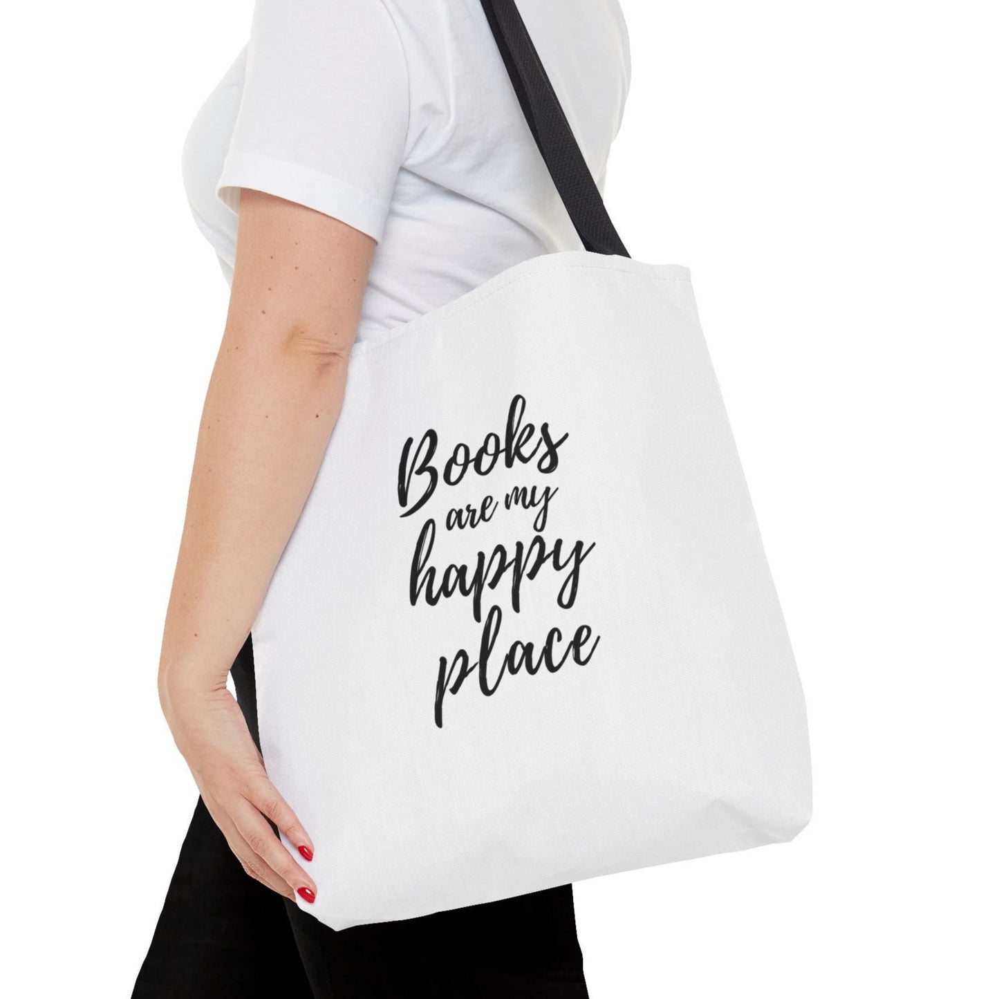 A black and white tote bag with a graphic of a book cover, with straps and handles.