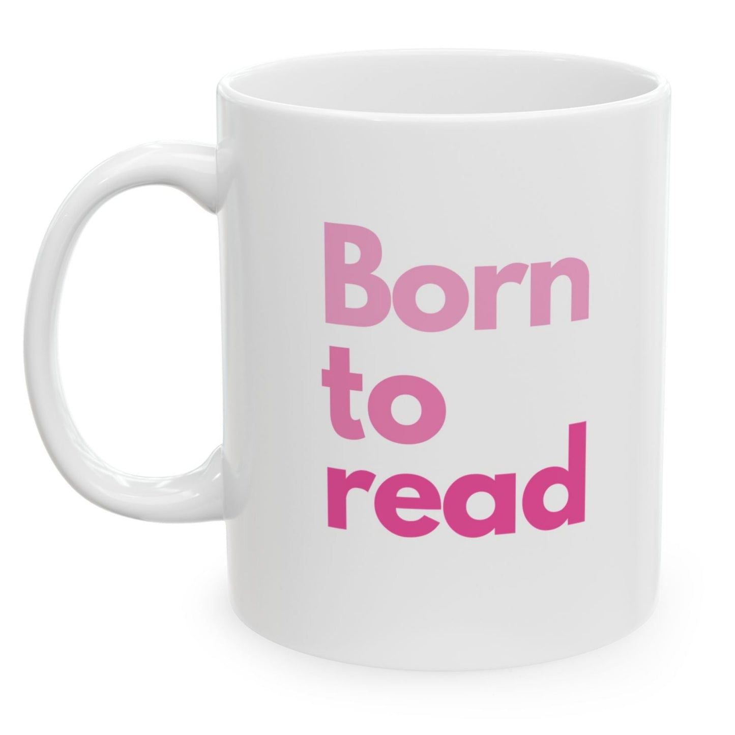 White mug with pink text 'Born to read' on a white background