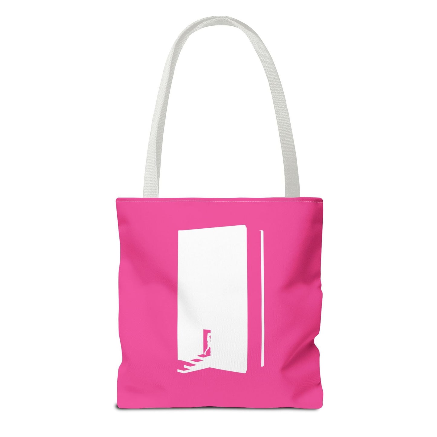 A pink and white tote bag with the text 'Books are my happy place' printed in colorful letters.