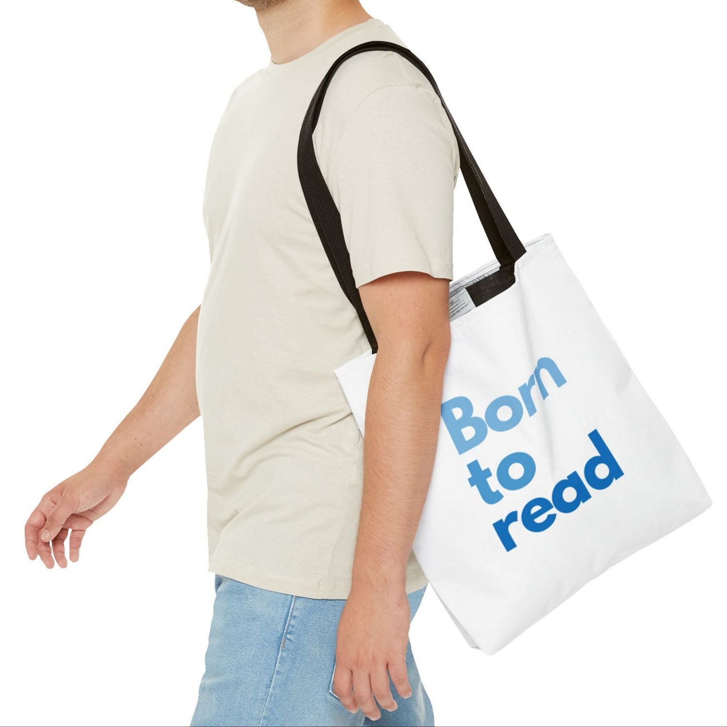 Man carrying a tote bag with 'Born to read' text on a white background