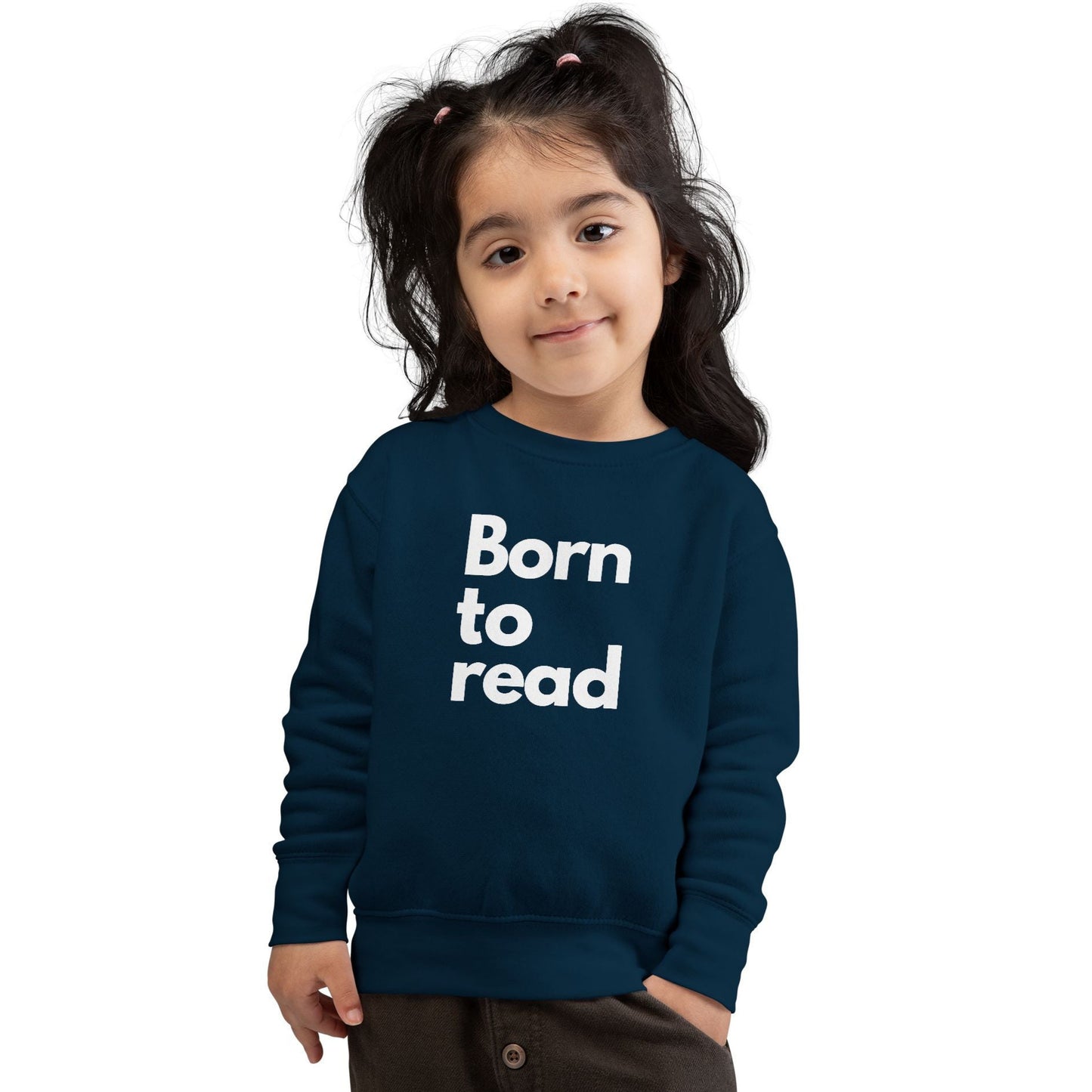 Child wearing a navy blue sweatshirt with 'Born to read' text on a white background