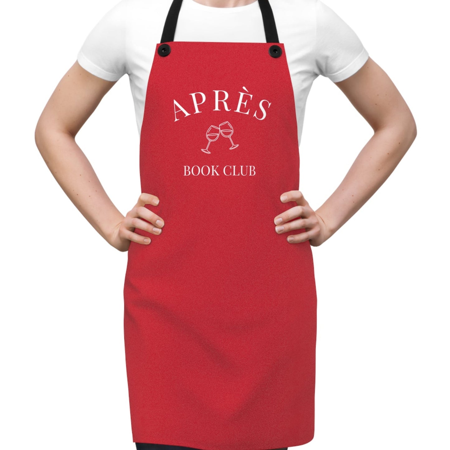 Red apron with 'APRèS BOOK CLUB' text worn by a person on a white background
