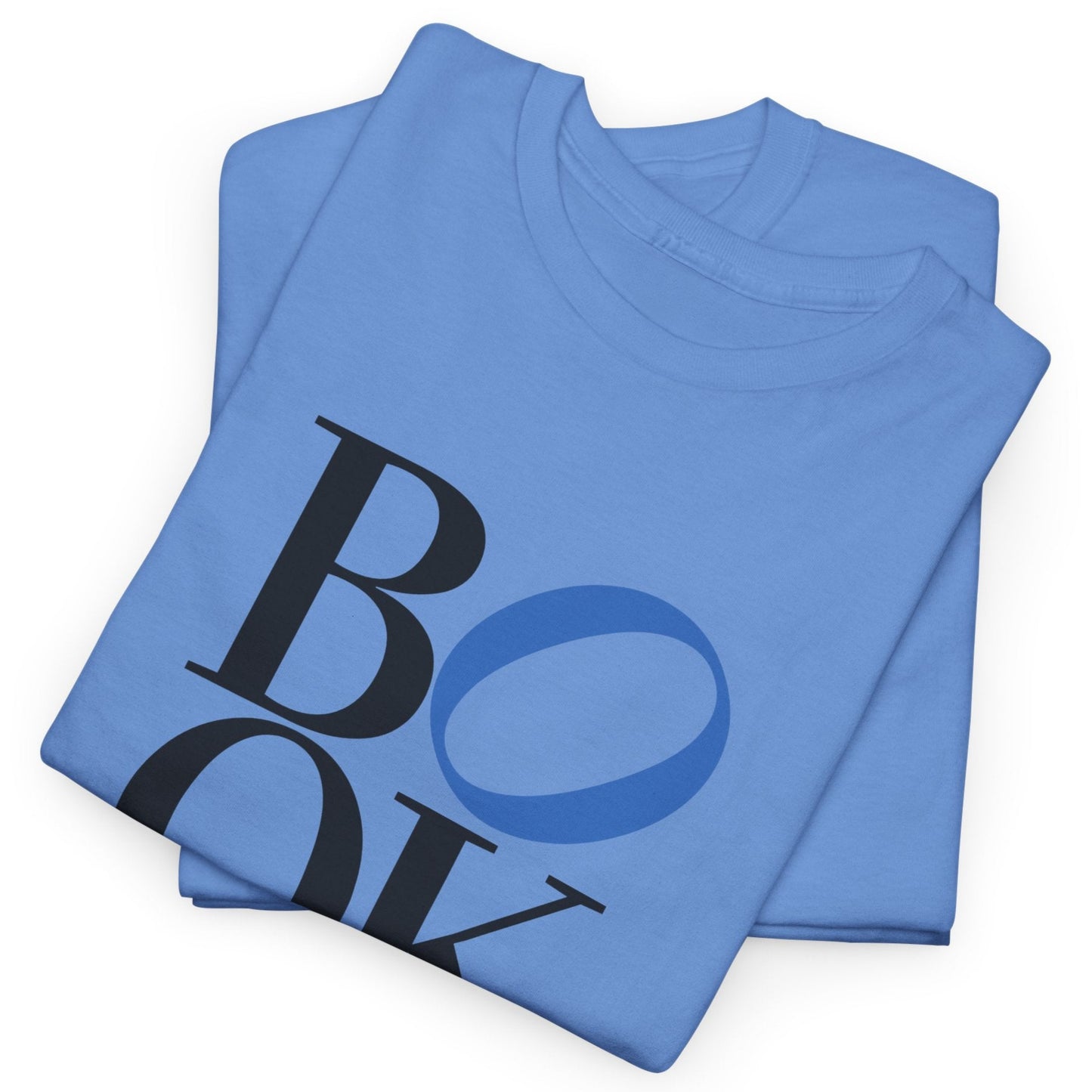 Folded blue t-shirt with 'BOY' printed on it against a white background