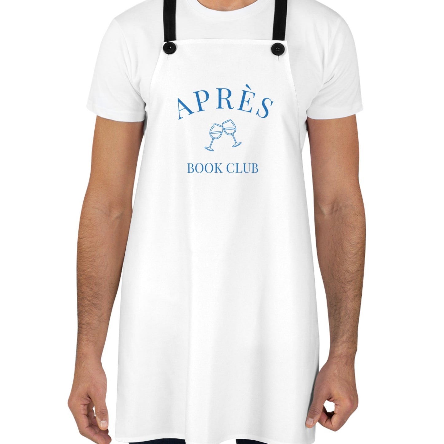 Person wearing a white apron with 'APRèS BOOK CLUB' text and graphics on a white background