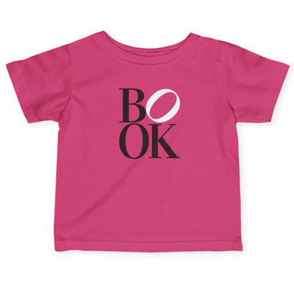 Pink t-shirt with 'BOOK' printed on it against a white background