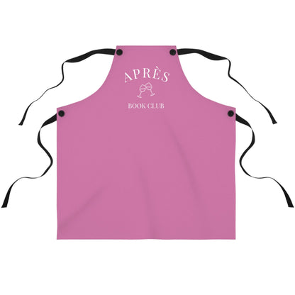 Pink apron with 'APRÈS BOOK CLUB' text on a white background