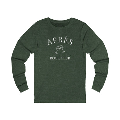 Green long-sleeve shirt with 'Apres Book Club' text and wine glass graphics on a white background