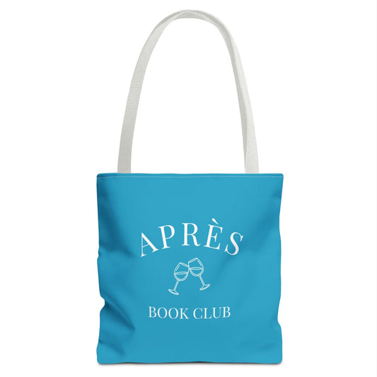 Blue tote bag with 'APRÈS BOOK CLUB' text and graphics on a white background