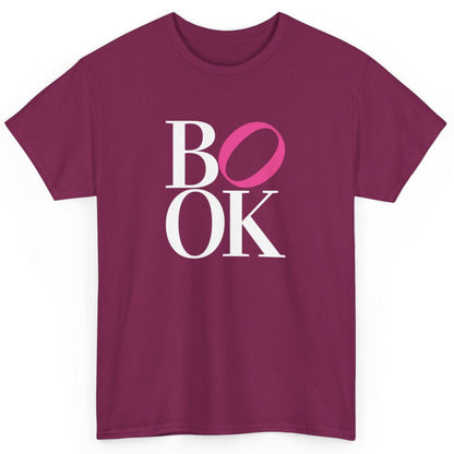Magenta t-shirt with 'BOOK' text design on a white background