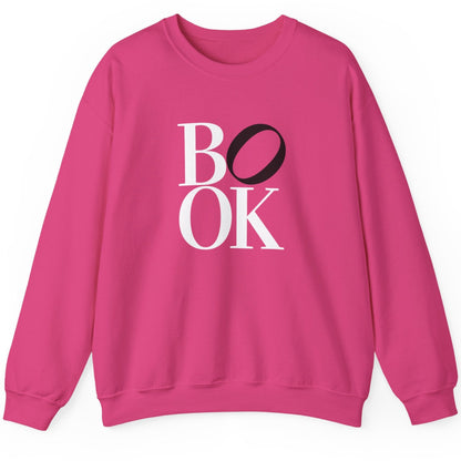 Pink sweatshirt with 'BOOK' text on a white background