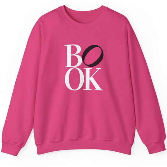 Pink sweatshirt with 'BOOK' text on a white background