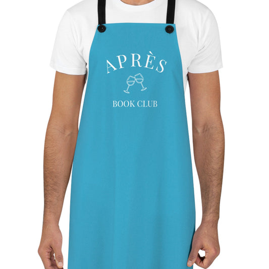 Person wearing a blue apron with 'APRèS BOOK CLUB' text and graphics on a white background