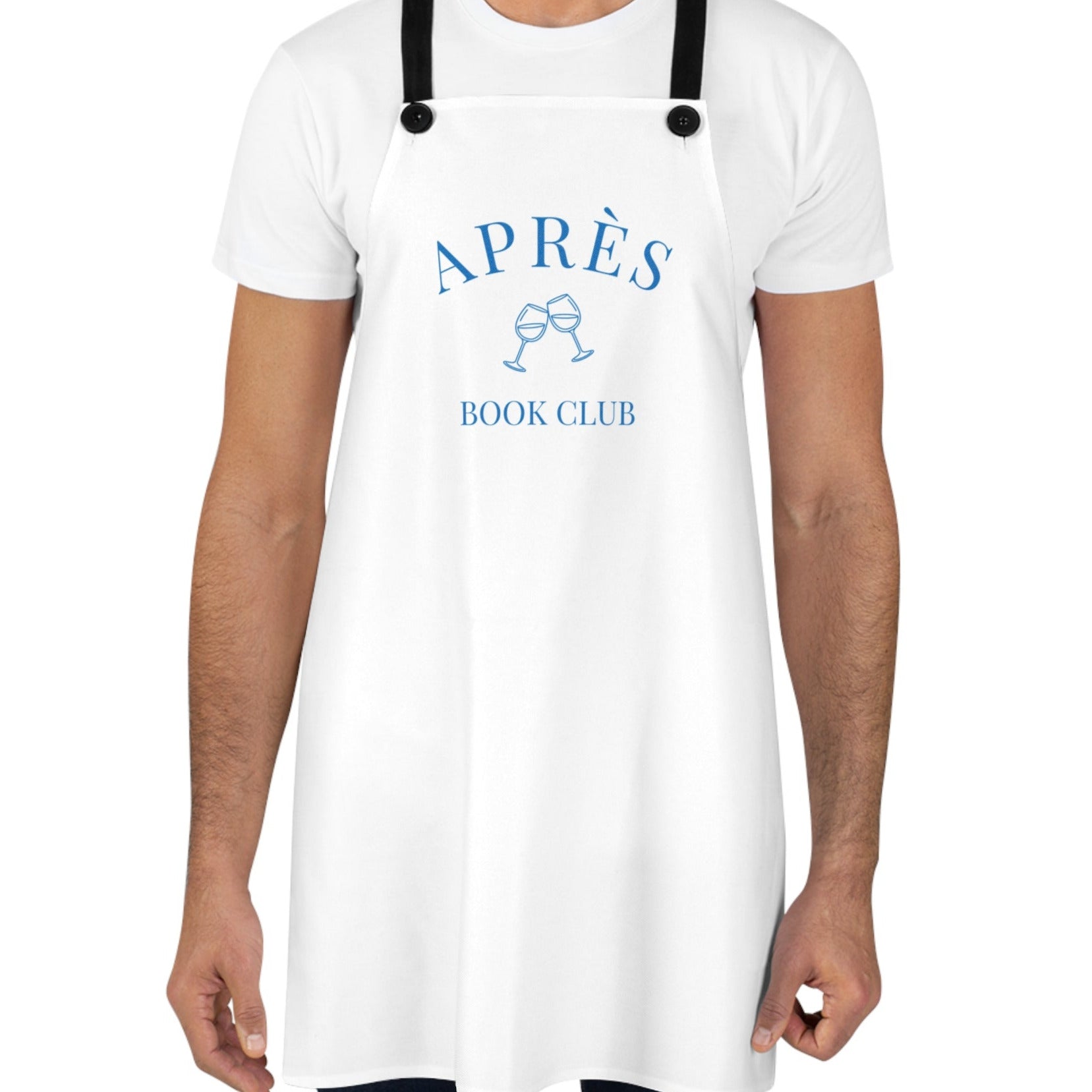 Person wearing a white apron with 'APRèS BOOK CLUB' text and graphics on a white background