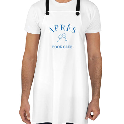 Person wearing a white apron with 'APRèS BOOK CLUB' text and graphics on a white background