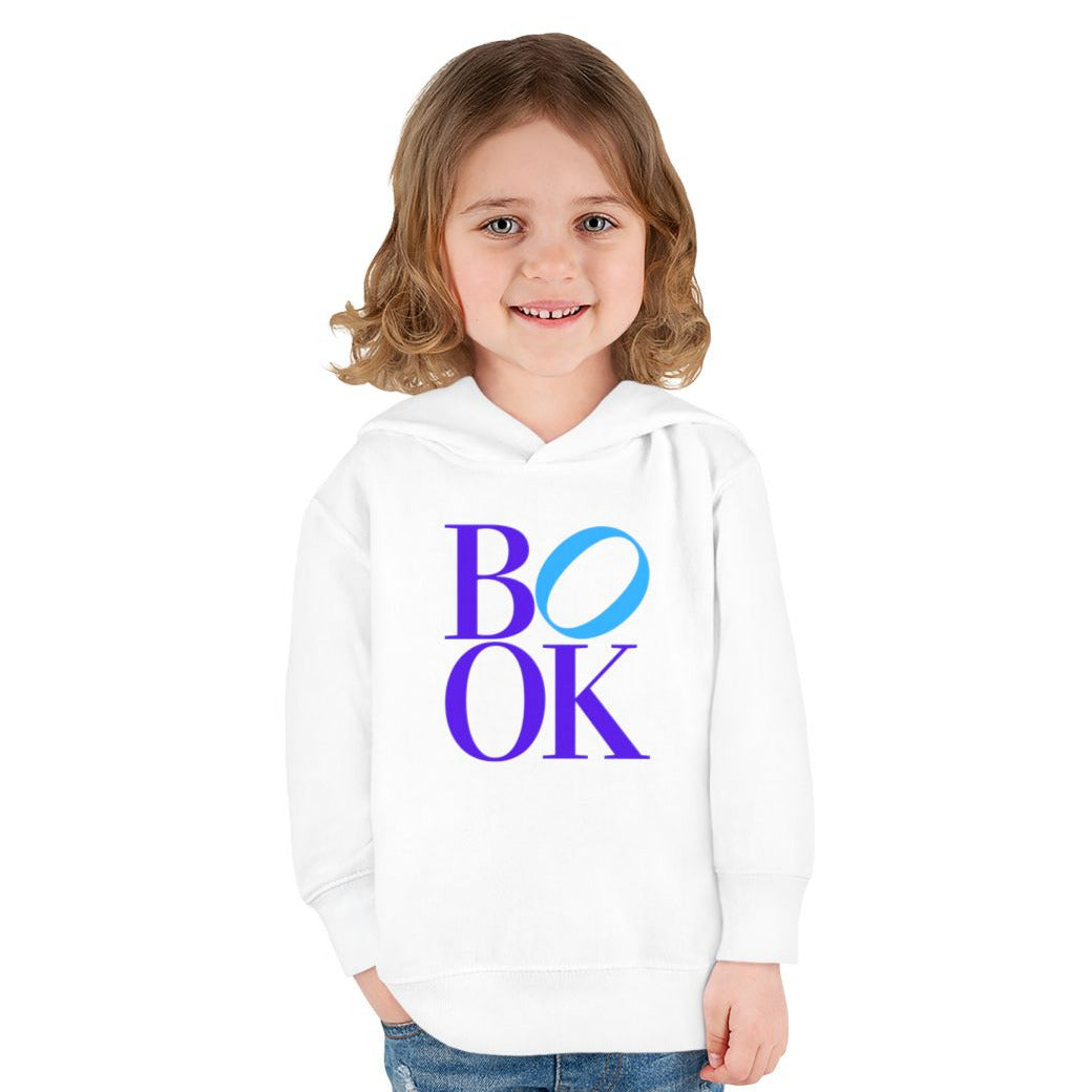 Child wearing a white hoodie with 'BOOK' printed on it against a white background